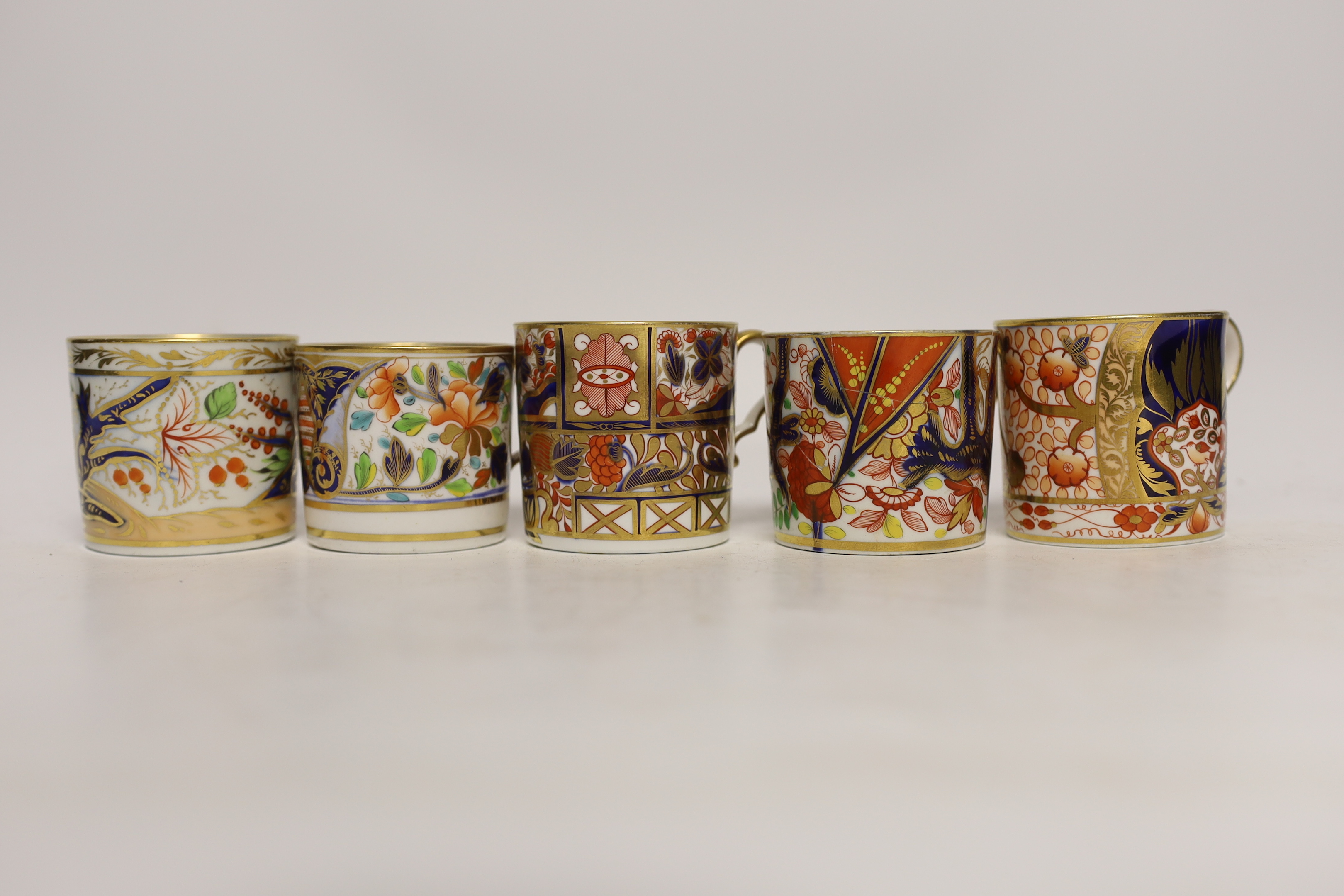 Twelve 1800-1820 English Imari style patterned coffee cans